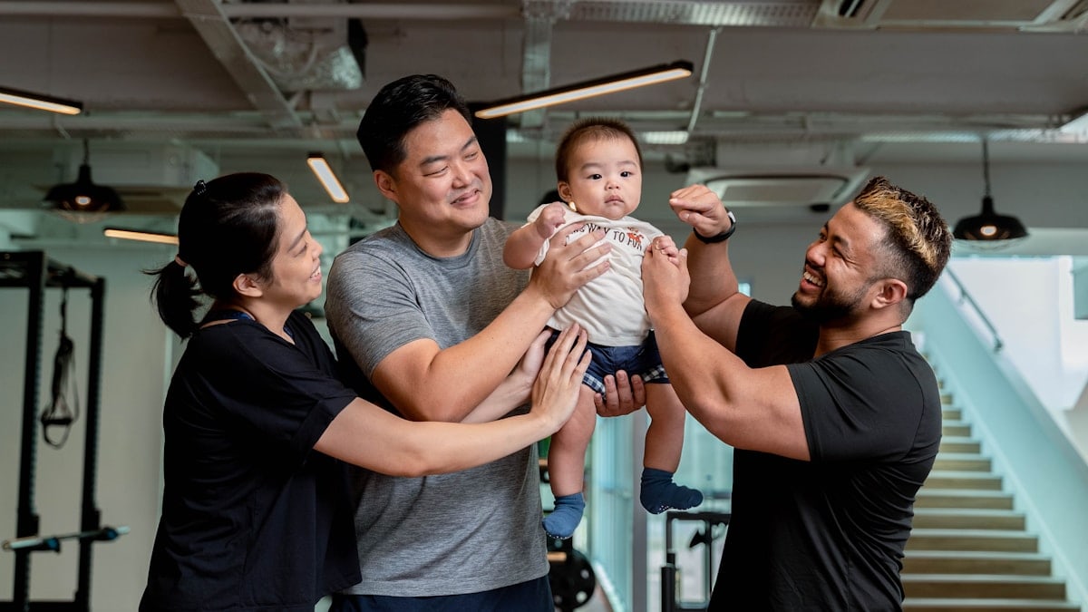Happy People Bringing Baby To The Gym